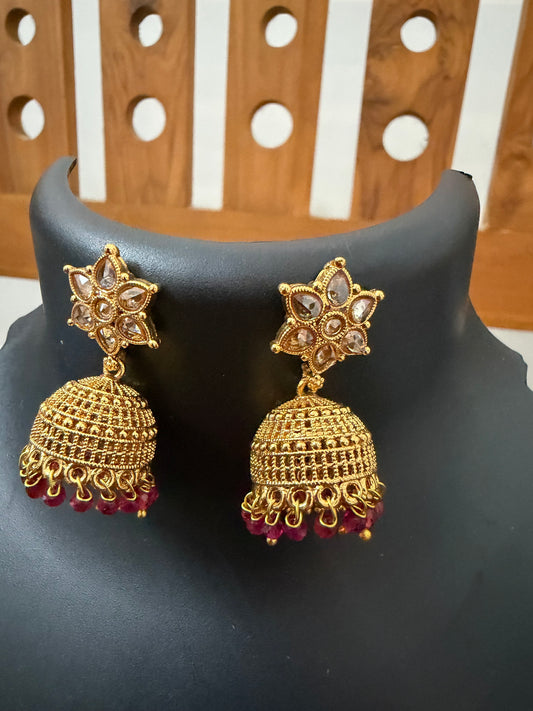 AD stone Jhumka star stud and ruby stones