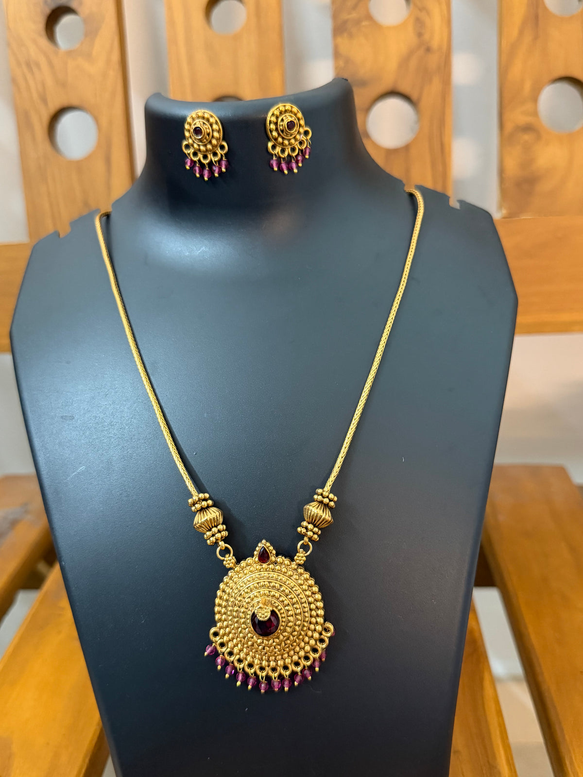 Haram red stone center locket