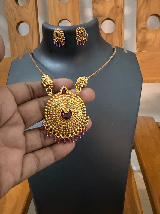 Haram red stone center locket