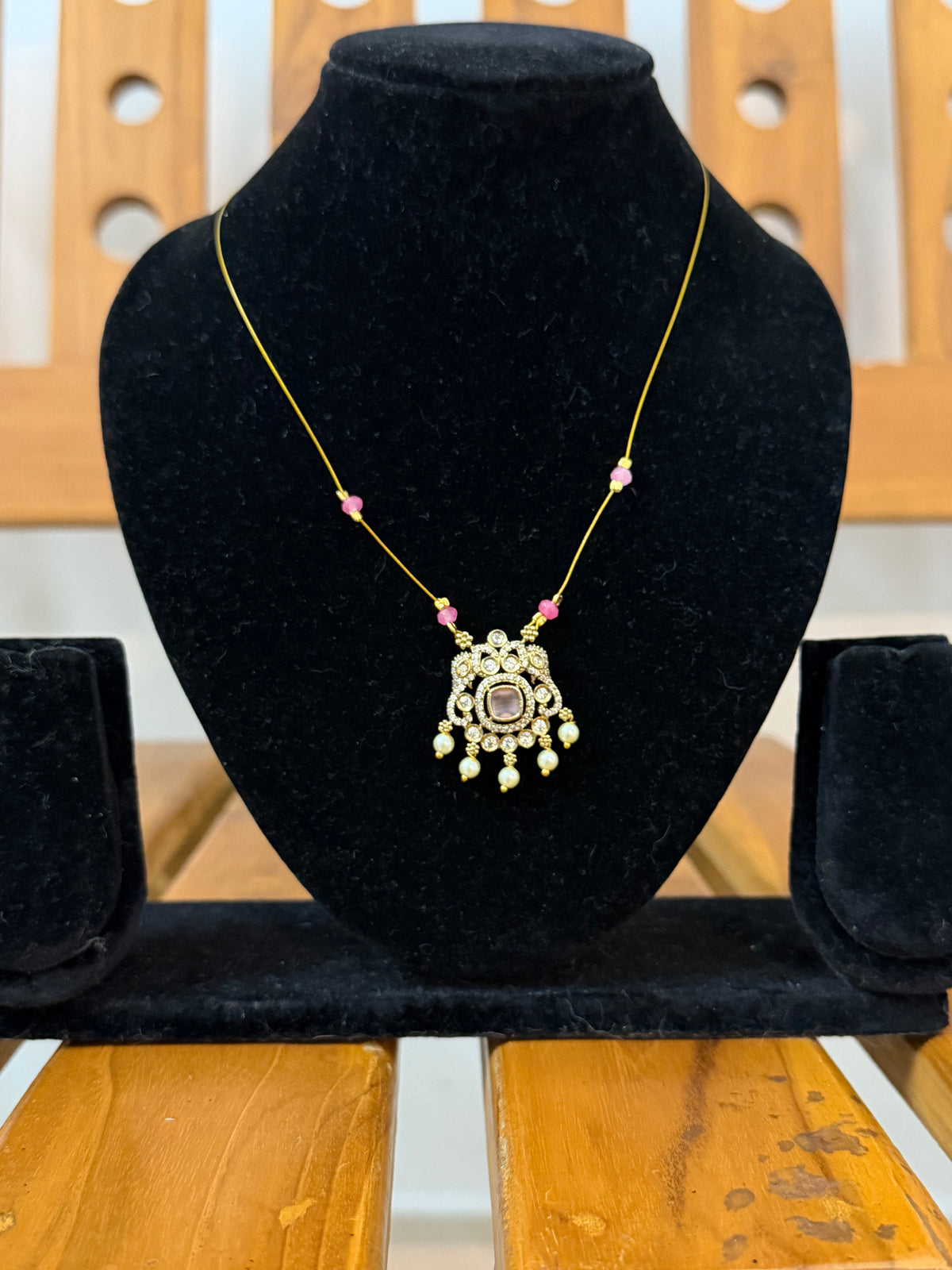 Invisible necklace with pastel soft pink stone