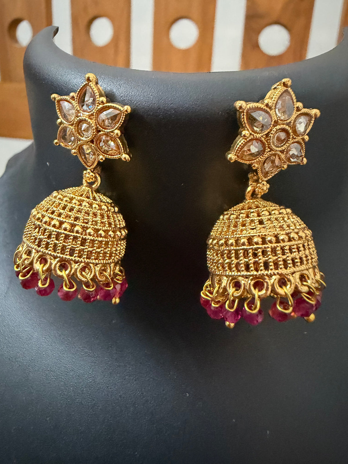 AD stone Jhumka star stud and ruby stones