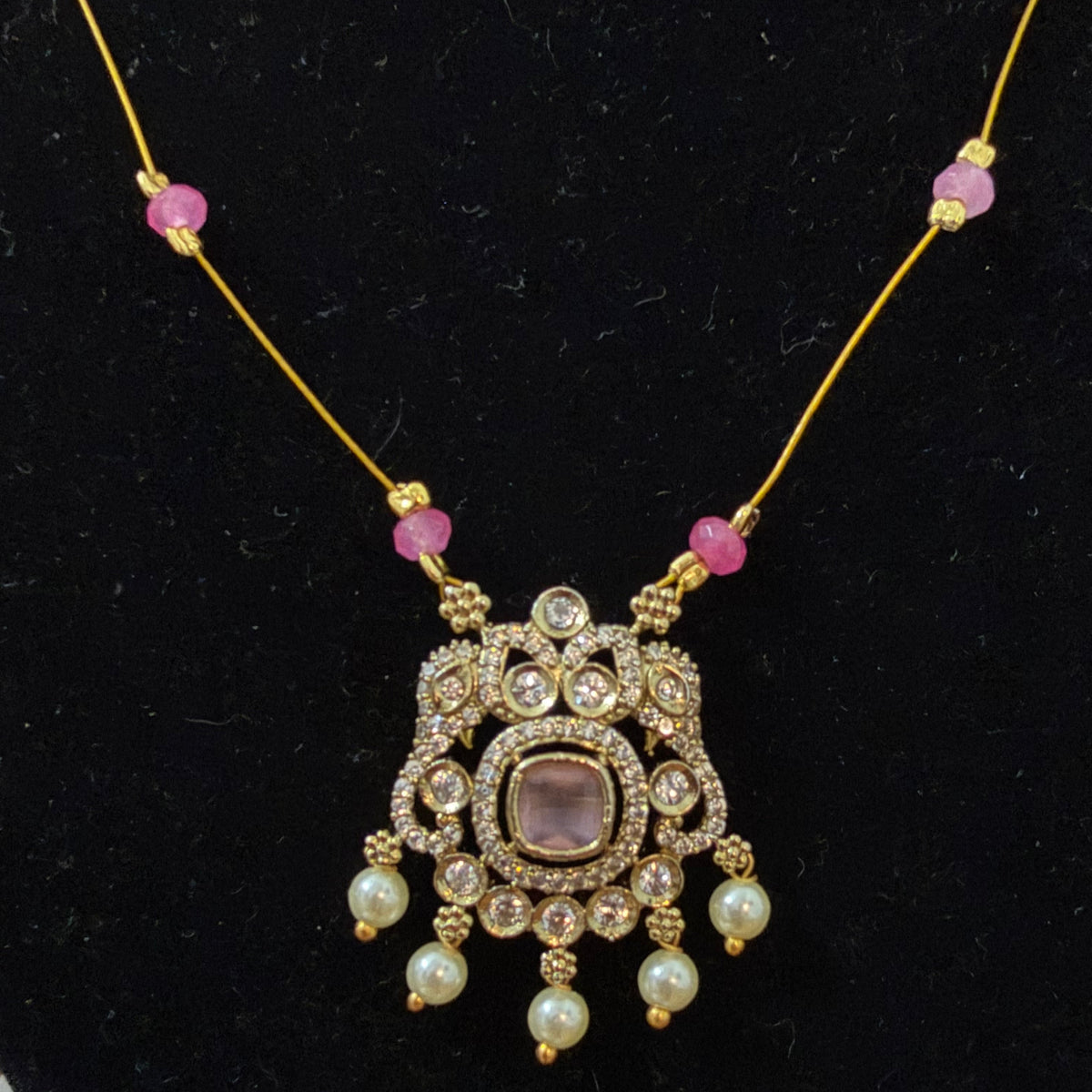 Invisible necklace with pastel soft pink stone