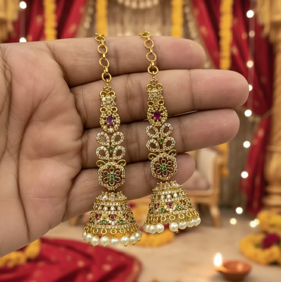 Traditional Temple Jhumka Earrings – Antique Gold Finish | Ruby & Emerald Stone Jhumkis